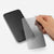 holding a screen protector in the hand and wants to apply it on a phone