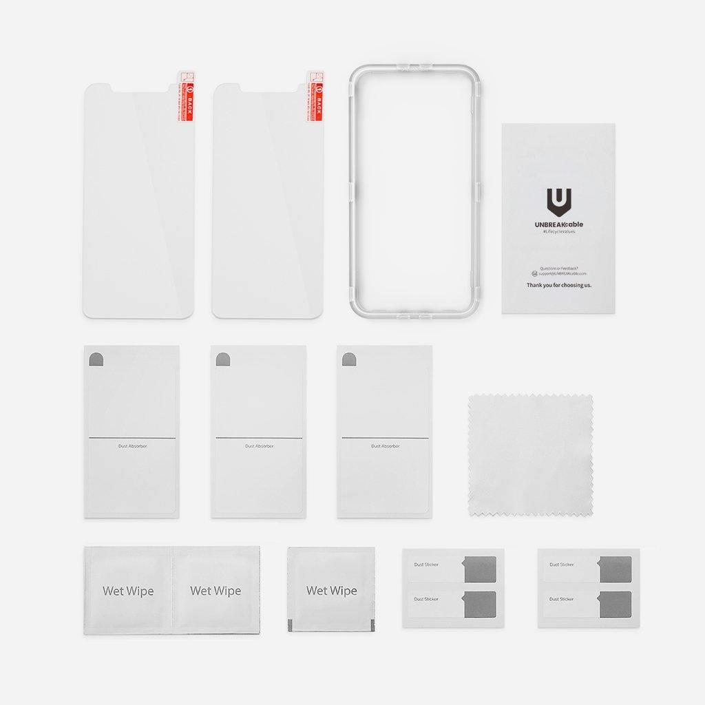 a black and white photo of a white bench