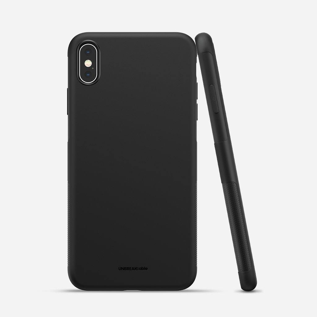 a black piece of luggage sitting on top of a table 